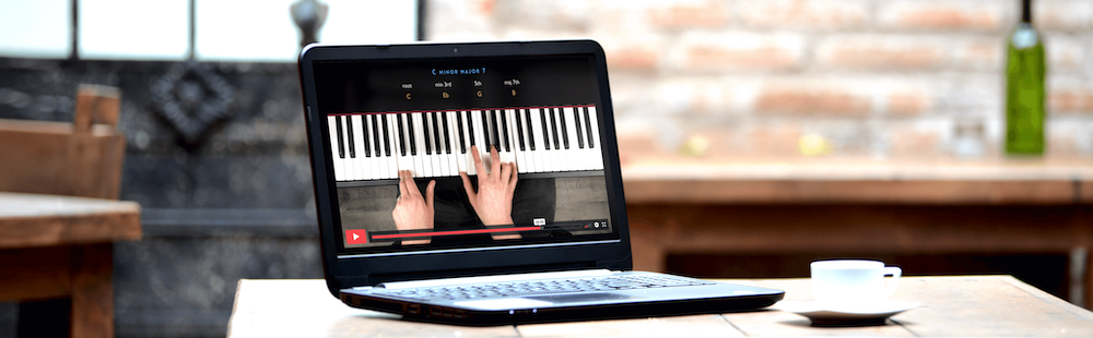 watching Jazz piano video lesson on a laptop